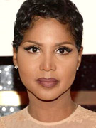 Singing sensation toni braxton lets her audience peek at her underwear while singing on a live stage wearing her glittery silver mini dress.