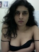 Petite body indian nymph stripping off her black lingerie and showing her shaved pussy and breasts.