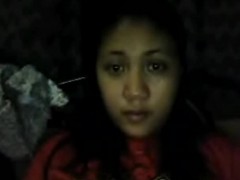 Busty indian hottie undressing and rubbing her twat on a cam.