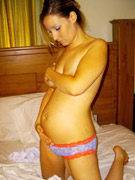 Voluptuous pregnant bitch in her sexy red polka dots two piece nastily plays her pussy herself with a vibrator