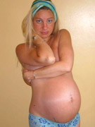 Seductive pregnant bitch in her white laced lingerie goes nasty with her blue dildo