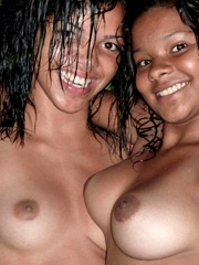 Two chocolate exotic gals with big tits having much fun taking part in amateur photo session