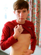 Lovely guy in a red jumper undressing on cam and showing off his dick