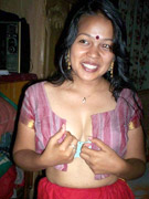 Ponytailed indian cutie taking off her bra before sex