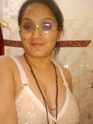 Amateur indian girl posing in white bra and tight red panties.