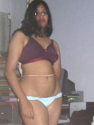 Dark haired young indian babe in national outfit and pink panty slowly stripteasing on a cam.