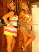 The twins peel off their sundresses to reveal their hot bodies