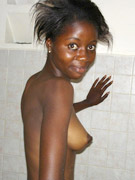 Black small-titted beauty with hairy underarms and pussy taking shower