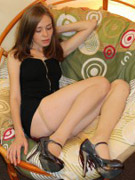 Sensual erotic woman poses in vintage decor. tags: vintage erotica, erotic women, chair, close up, vibrator