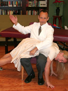 Flashy blonde with gorgeous big boobs gets her luscious booty spanked by a doctor.