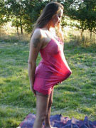 Jane outdoors in pink negligee covering huge strapon