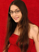 Cute brunette teen babe in glasses exposing her slim body