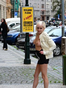 Gorgeous blonde babe exposing her tight cunt and big tits in public.